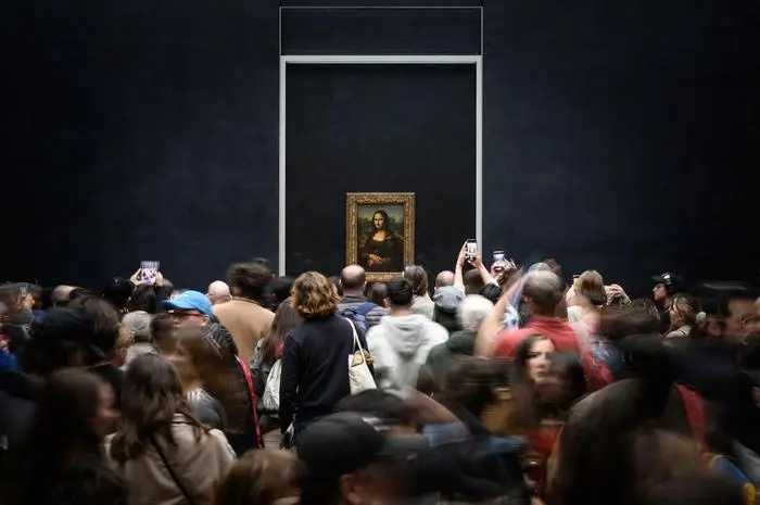 (FILES) Visitors take picture of the painting 