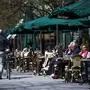 People sit in a restaurant in Stockholm on May 8, 2020, amid the coronavirus COVID-19 pandemic. (Photo by Jonathan NACKSTRAND / AFP)