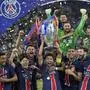 PSG players celebrate with the trophy after winning the Champions League final soccer match between Paris Saint-Germain and Inter Milan at the Allianz Arena in Munich, Germany, Saturday, May 31, 2025. (AP Photo/Matthias Schrader)