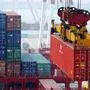 A crane moves a shipping container in the container pool of a seaport in Qingdao in eastern China's Shandong province Tuesday, October 13, 2015. China's imports fell by an unexpectedly wide margin in September in a new sign of weakness in the world's second-largest economy. Imports plunged 20.4 percent from a year earlier to $145.2 billion, customs data showed Tuesday, worse than August's 5.5 percent decline and analysts' expectations of about 15 percent. (Chinatopix Via AP) CHINA OUT,sujet wirtschaft, import, export