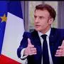 French President Emmanuel Macron is seen on screen as he speaks during a TV interview from the Elysee Palace, in Paris, on March 22, 2023. - French President is to make on March 22, 2023 his first public comments on the crisis sparked by his government forcing through a pensions overhaul, which has sparked violent protests and questions over his ability to bring about further change. (Photo by Ludovic MARIN / AFP)