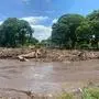 View of a river swollen due to heavy rains after the passage of hurricane Beryl on the highway from Cumana to Cumanacoa, Sucre State, Venezuela, on July 2, 2024. Hurricane Beryl churned towards Jamaica Tuesday after killing at least five people and causing widespread destruction across the southeastern Caribbean, threatening deadly winds and storm surge as it approached. (Photo by Victor GONZALEZ / AFP)