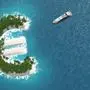 Tax haven, financial or wealth evasion on a euro island. A luxury boat is sailing to the island.
