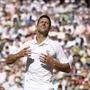 Serbia's Novak Djokovic celebrates after beating Australia's Nick Kyrgios to win the final of the men's singles on day fourteen of the Wimbledon tennis championships in London, Sunday, July 10, 2022. (AP Photo/Kirsty Wigglesworth)