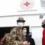 Italy's commissioner for COVID emergency Francesco Paolo Figliuolo, center, visits a new vaccination hub for coronavirus at the Porta di Roma shopping arcade, in Rome, Sunday, May 2, 2021. (Cecilia Fabiano/LaPresse via AP)
