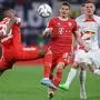 (L to R) Bayern Munich's Dutch midfielder Ryan Gravenberch, Bayern Munich's Austrian midfielder Marcel Sabitzer and Leipzig's German defender Marcel Halstenberg vie for the ball during the German Supercup football match between RB Leipzig and FC Bayern Munich in Leipzig, on July 30, 2022. (Photo by Ronny HARTMANN / AFP) / DFL REGULATIONS PROHIBIT ANY USE OF PHOTOGRAPHS AS IMAGE SEQUENCES AND/OR QUASI-VIDEO