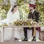 Jordan's Crown Prince Hussein and Rajwa Alseif sit during the wedding ceremony in Amman, Jordan, Thursday, June 1, 2023. (Royal Hashemite Court via AP)