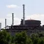 (FILES) This photographs shows a view of the Russian-controlled Zaporizhzhia nuclear power plant, in southern Ukraine on June 15, 2023. A fire broke out August 11, 2024 at a cooling tower of the Zaporizhzhia nuclear power plant in southern Ukraine, which is under the control of Russian forces, a Moscow-installed official said. "As a result of shelling of the town of Energodar by the Ukrainian armed forces, there was a fire at a cooling system," Yevgeny Balitsky, the Russian-installed governor of Ukraine's Zaporizhzhia region said on Telegram. Both Balitsky and Ukrainian President Volodymyr Zelensky said there had been no detected change in the radiation levels around the plant, as Zelensky accused Russian forces of having started the fire. (Photo by Olga MALTSEVA / AFP)