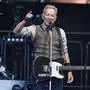 Bruce Springsteen speaks to the audience during a concert with the E Street Band at the Olympic Stadium in Berlin, Germany, Wednesday, June 11, 2025. (AP Photo/Markus Schreiber)