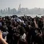 People take part in a march at the Tsim Sha Tsui district in Hong Kong on December 1, 2019. - Tens of thousands of black-clad protesters flooded into the streets of Hong Kong on Sunday, ending a brief election lull and demanding the government make concessions after pro-democracy candidates won a landslide victory. (Photo by NICOLAS ASFOURI / AFP)