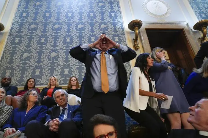 A man shouts as he interrupts President Joe Biden during the State of the Union address to a joint session of Congress at the U.S. Capitol, Thursday March 7, 2024, in Washington. (AP Photo/Andrew Harnik)