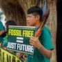 Indigenous activists protest outside the International Convention Center in Brasilia, on October 14, 2025, during the pre-COP30 preparatory meeting that gathers ministers in charge of climate negotiations. (Photo by Sergio Lima / AFP)