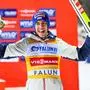 Winner Stefan Kraft of Austria celebrates on the podium after the Men's Ski Jumping World Cup, normal hill at the Lugnet Stadium in Falun, Sweden, Tuesday Nov. 25, 2025. (Fredrik Sandberg/TT via AP)