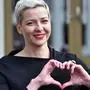 (FILES) In this file photo taken on July 14, 2020 Maria Kolesnikova, a coordinator of Viktor Babaryko's campaign headquarters, makes a heart sign with her hands outside the headquarters of Belarus' Central Electoral Commission in Minsk. - Top ally of Belarus's leading opposition candidate Maria Kolesnikova was detained by police on August 8, 2020 on the eve of a tense presidential vote, her office said. A spokeswoman for presidential hopeful Svetlana Tikhanovskaya told AFP that Maria Kolesnikova had been held by police in the evening of August 8, 2020. Earlier in the day authorities held Tikhanovskaya's campaign chief. (Photo by Sergei GAPON / AFP)