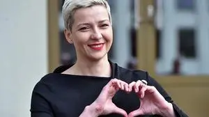 (FILES) In this file photo taken on July 14, 2020 Maria Kolesnikova, a coordinator of Viktor Babaryko's campaign headquarters, makes a heart sign with her hands outside the headquarters of Belarus' Central Electoral Commission in Minsk. - Top ally of Belarus's leading opposition candidate Maria Kolesnikova was detained by police on August 8, 2020 on the eve of a tense presidential vote, her office said. A spokeswoman for presidential hopeful Svetlana Tikhanovskaya told AFP that Maria Kolesnikova had been held by police in the evening of August 8, 2020. Earlier in the day authorities held Tikhanovskaya's campaign chief. (Photo by Sergei GAPON / AFP)