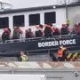 A group of people thought to be migrants are brought in to Dover, Kent, England, from a Border Force vessel following a small boat incident in the Channel, Saturday, March 30, 2024. (Gareth Fuller/PA via AP)
