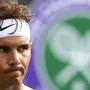 (FILES) In this file photo taken on July 2, 2019 Spain's Rafael Nadal reacts after a point against Japan's Yuichi Sugita during their men's singles first round match on the second day of the 2019 Wimbledon Championships at The All England Lawn Tennis Club in Wimbledon, southwest London. - Rafael Nadal has announced, June 17, he will not be playing at Wimbledon or the Olympic Games this year. (Photo by Daniel LEAL-OLIVAS / AFP) / RESTRICTED TO EDITORIAL USE