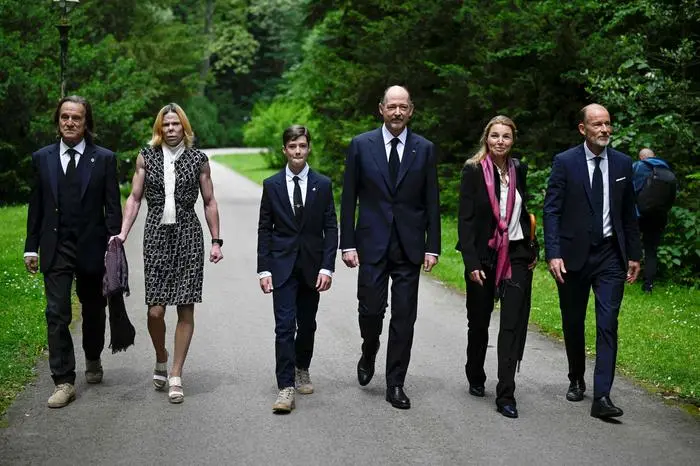 (R/L): Bulgaria's Prince Kyril of Preslav, Rosario Nadal, Prince Konstantin-Assen of Vidin, Simeon-Hassan Munoz, Princess Kalina and her husband Kitin Munoz attend the funeral ceremony of King Ferdinand I of Bulgaria in Vrana Palace in Sofia on May 29, 2024. The remains of Ferdinand, Bulgaria's first king after five centuries of Ottoman rule, were repatriated  to be reburied 76 years after his death in Germany. After a liturgical service in accordance with the Catholic and Orthodox rites, Ferdinand (1887-1948) has been buried in the family crypt at the Vranya palace, where Simeon of Saxe-Coburg Gotha, the last Bulgarian king to be ousted by the communist regime in 1946 at the age of 9, currently lives. (Photo by Nikolay DOYCHINOV / AFP)