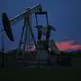 A pumpjack is pictured as the sun sets Tuesday, April 21, 2020, in Oklahoma City. Oil prices continue to drop, because very few people are flying or driving, and factories have shut amid widespread stay-at-home orders due to coronavirus concerns. (AP Photo/Sue Ogrocki)