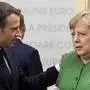 German Chancellor Angela Merkel, right, speaks with French President Emmanuel Macron, center, during a round table meeting at an EU summit in Sibiu, Romania, Thursday, May 9, 2019. European Union leaders on Thursday start to set out a course for increased political cooperation in the wake of the impending departure of the United Kingdom from the bloc. (Ludovic Marin, Pool Photo via AP)