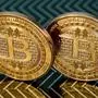 (FILES) In this file photo illustration taken on June 17, 2014 in Washington, DC shows bitcoin medals. - The US has seized more than $1 billion worth of bitcoin connected to the Silk Road criminal syndicate, the Justice Department announced on November 5, 2020. (Photo by KAREN BLEIER / AFP)