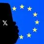 (FILES) This illustration photograph shows the logo of X (formerly Twitter) social network displayed on a smartphone in front a Euopean Union flag in Brussels on September 29, 2025. The EU's tech chief on December 5, 2025 denied a US charge it was engaging in "censorship" by fining Elon Musk's X platform for breaking the bloc's rules on digital content. (Photo by Nicolas TUCAT / AFP)