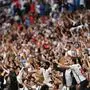 TOPSHOT - England supporters celebrate their win in the UEFA EURO 2020 round of 16 football match between England and Germany at Wembley Stadium in London on June 29, 2021. (Photo by JUSTIN TALLIS / POOL / AFP)