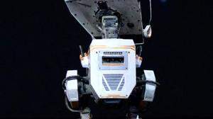 NVIDIA's founder and CEO Jensen Huang speaks next to a robot during a keynote address on the latest innovations in AI, during a developers conference at the SAP Center in San Jose, California, on March 18, 2024. Nvidia unveiled its latest family of chips for powering artificial intelligence, as it seeks to consolidate its position as the major supplier to the AI frenzy. (Photo by JOSH EDELSON / AFP)