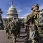 FILE - National Guard troops reinforce security around the U.S. Capitol ahead of expected protests leading up to President-elect Joe Biden's inauguration, in Washington, Sunday, Jan. 17, 2021.  (AP Photo/J. Scott Applewhite, File)