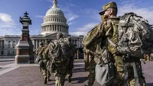 FILE - National Guard troops reinforce security around the U.S. Capitol ahead of expected protests leading up to President-elect Joe Biden's inauguration, in Washington, Sunday, Jan. 17, 2021.  (AP Photo/J. Scott Applewhite, File)