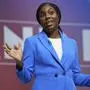FILE - Conservative leadership candidate Kemi Badenoch addresses members during the Conservative Party Conference at the International Convention Centre in Birmingham, England, Wednesday, Oct. 2, 2024. (AP Photo/Kin Cheung, File)