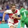 Croatia's Luka Modric celebrates after scoring his side's opening goal during a Group B match between Croatia and Italy at the Euro 2024 soccer tournament in Leipzig, Germany, Monday, June 24, 2024. (AP Photo/Ebrahim Noroozi)