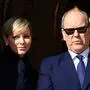 Princess Charlene of Monaco (L) and Prince's Albert II of Monaco appear on the balcony during the traditional festivities of Sainte Devote in the Principalty of Monaco on January 27, 2024. (Photo by Valery HACHE / AFP) / RESTRICTED TO EDITORIAL USE/NO TABLOID