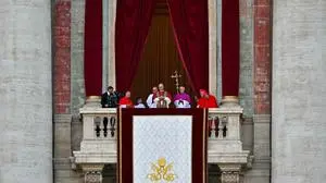 Newly elected Pope Leo XIV, Robert Prevost arrives on the main central loggia balcony of the St Peter's Basilica for the first time, after the cardinals ended the conclave, in The Vatican, on May 8, 2025. Robert Francis Prevost was on Thursday elected the first pope from the United States, the Vatican announced. A moderate who was close to Pope Francis and spent years as a missionary in Peru, he becomes the Catholic Church's 267th pontiff, taking the papal name Leo XIV. (Photo by Andreas SOLARO / AFP)