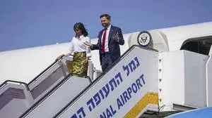 Vice President J.D. Vance, right, and Second Lady Usha Vance arrive at Ben Gurion airport in Tel Aviv, Israel, Tuesday, Oct. 21, 2025. (Nathan Howard/Pool Photo via AP)