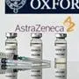 (FILES) This file photograph taken on November 17, 2020, shows an illustration of vials with Covid-19 Vaccine stickers attached and syringes, with the logo of the University of Oxford and its partner British pharmaceutical company AstraZeneca, in London. - Pharmaceutical group AstraZeneca has pulled out of a meeting with EU representatives meant to take place on January 27, 2021, to get to the bottom of delays of its Covid-19 vaccine, an EU official told AFP. (Photo by JUSTIN TALLIS / AFP)