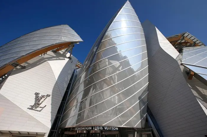 FILE - The Louis Vuitton Foundation building designed by American architect Frank Gehry is pictured before the presentation of Louis Vuitton's Spring/Summer 2015 ready-to-wear fashion collection in Paris, Wednesday, Oct. 1, 2014.  (AP Photo/Francois Mori, File)
