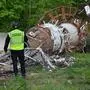 A Ukrainian Police investigator examines debis at the Kharkiv Television Tower, after officials reported a Russian strike on the tower, on the outskirts of Kharkiv on April 22, 2024. Photos and videos showed the top of the televion tower breaking off and grey smoke billowing from the structure after Kharkiv Governor Oleg Synegubov said in a social media post that Russia had hit a "television infrastructure facility." (Photo by SERGEY BOBOK / AFP)