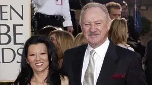 FILE - Actor Gene Hackman arrives with his wife, Betsy Arakawa, for the 60th Annual Golden Globe Awards in Beverly Hills, Calif., Sunday, Jan. 19, 2003. (AP Photo/Mark J. Terrill, File)