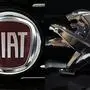 (FILES) (COMBO) This combination of file pictures created on October 31, 2019 shows the logo of Italian auto maker Fiat (L) in a cars dealer on January 12, 2017 in Saluzzo, near Turin, and the Peugeot logo pictured at the 2014 Paris Auto Show on October 3, 2014 in Paris. - PSA and Fiat Chrysler unveiled on October 31 a plan for a 50-50 merger of their operations to create the world's fourth-largest car manufacturer that would generate billions in savings without factory closures. In a joint statement the French and US-Italian carmakers said their boards of directors "have each unanimously agreed to work towards a full combination of their respective businesses by way of a 50/50 merger". (Photos by MARCO BERTORELLO and Joël SAGET / AFP)