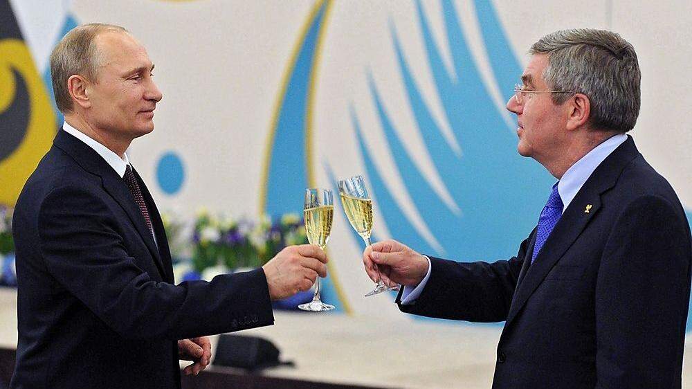 Wladimir Putin und IOC-Boss Thomas Bach