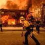 TOPSHOT - Firefighters work the scene as an apartment building burns during the Eaton fire in the Altadena area of Los Angeles county, California on January 8, 2025. At least five people are now known to have died in wildfires raging around Los Angeles, with more deaths feared, law enforcement said January 8, as terrifying blazes leveled whole streets, torching cars and houses in minutes.
More than 1,000 buildings have burned in multiple wildfires that have erupted around America's second biggest city, forcing tens of thousands of people from their homes. (Photo by JOSH EDELSON / AFP)