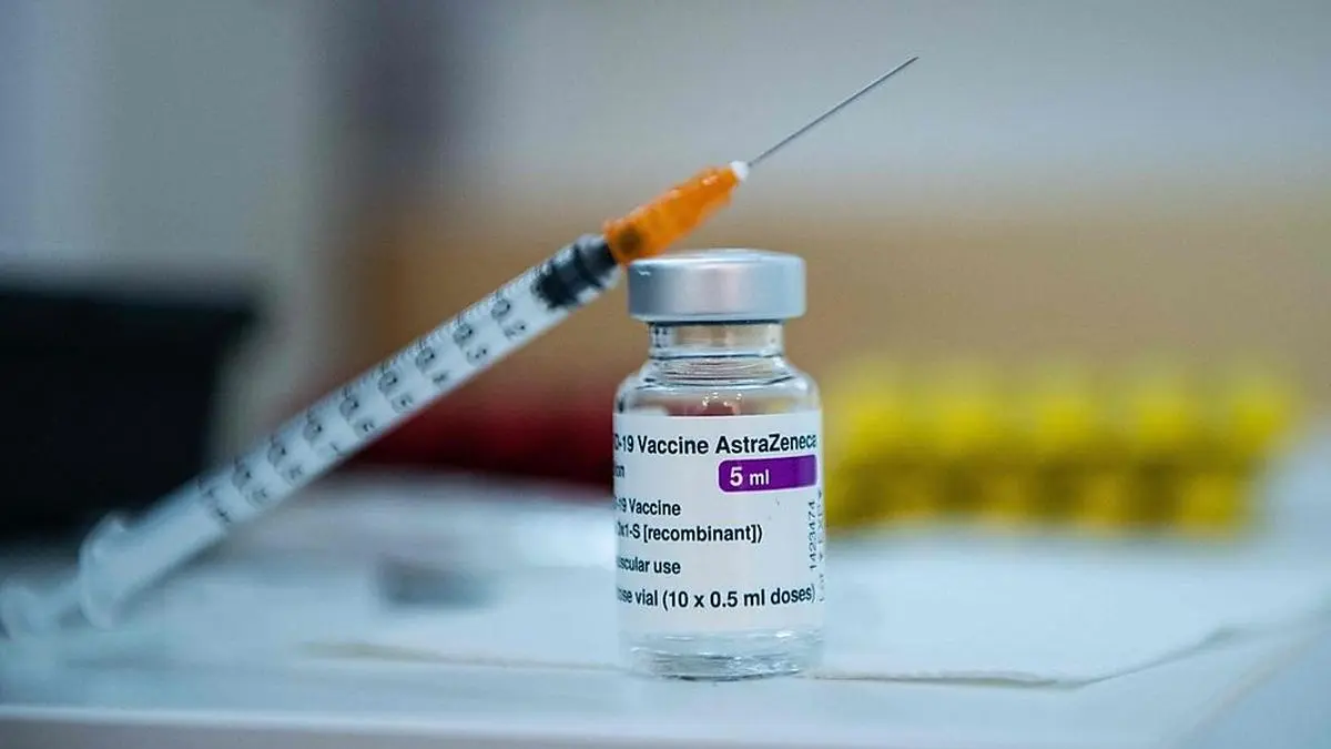 This photograph shows a syringe poses on a vial of AstraZeneca anti-covid-19 vaccine in a pharmacy in Paris on March 12, 2021, as pharmacies have been authorised to give Covid-19 vaccinations - for the first time in the vaccination campaign in France. (Photo by Martin BUREAU / AFP)