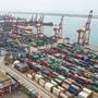 This aerial photo shows cargo containers stacked at a port in Lianyungang in China's eastern Jiangsu province on May 9, 2022. - China's export growth slumped in April to its lowest level in almost two years, customs data showed on May 9, as a Covid resurgence shuttered factories, sparked transport curbs and caused congestion at key ports. (Photo by AFP) / China OUT