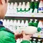Man shopping milk in grocery store