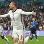 England's defender Luke Shaw (C) celebrates after scoring the first goal during the UEFA EURO 2020 final football match between Italy and England at the Wembley Stadium in London on July 11, 2021. (Photo by Andy Rain / POOL / AFP)