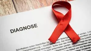 25 February 2023: Diagnosis from the doctor - cancer. Document with the inscription diagnosis and a red ribbon. Symbol image cancer disease *** Diagnose vom Arzt - Krebs. Schriftstück mit der Aufschrift Diagnose und einer roten Schleife. Symbolbild Krebs Erkrankung