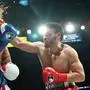 TOPSHOT - USA's Jake Paul (L) and Mexico's Julio Cesar Chavez Jr. fight during their cruiserweight boxing bout at the Honda Center in Anaheim, California, on June 28, 2025. (Photo by Patrick T. Fallon / AFP)