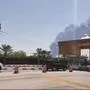 This AFPTV screen grab from a video made on September 14, 2019, shows smoke billowing from an Aramco oil facility in Abqaiq about 60km (37 miles) southwest of Dhahran in Saudi Arabia's eastern province. - Drone attacks sparked fires at two Saudi Aramco oil facilities early today, the interior ministry said, in the latest assault on the state-owned energy giant as it prepares for a much-anticipated stock listing. Yemen's Iran-aligned Huthi rebels claimed the drone attacks, according to the group's Al-Masirah television. (Photo by - / AFP)