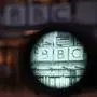 This general view shows the viewfinder of a camera set up at the entrance outside the offices of the BBC in London on November 10, 2025. The director general of the BBC announced his resignation on November 9 following a row over the editing of a documentary about Donald Trump as the US president attacked "corrupt journalists". (Photo by HENRY NICHOLLS / AFP)